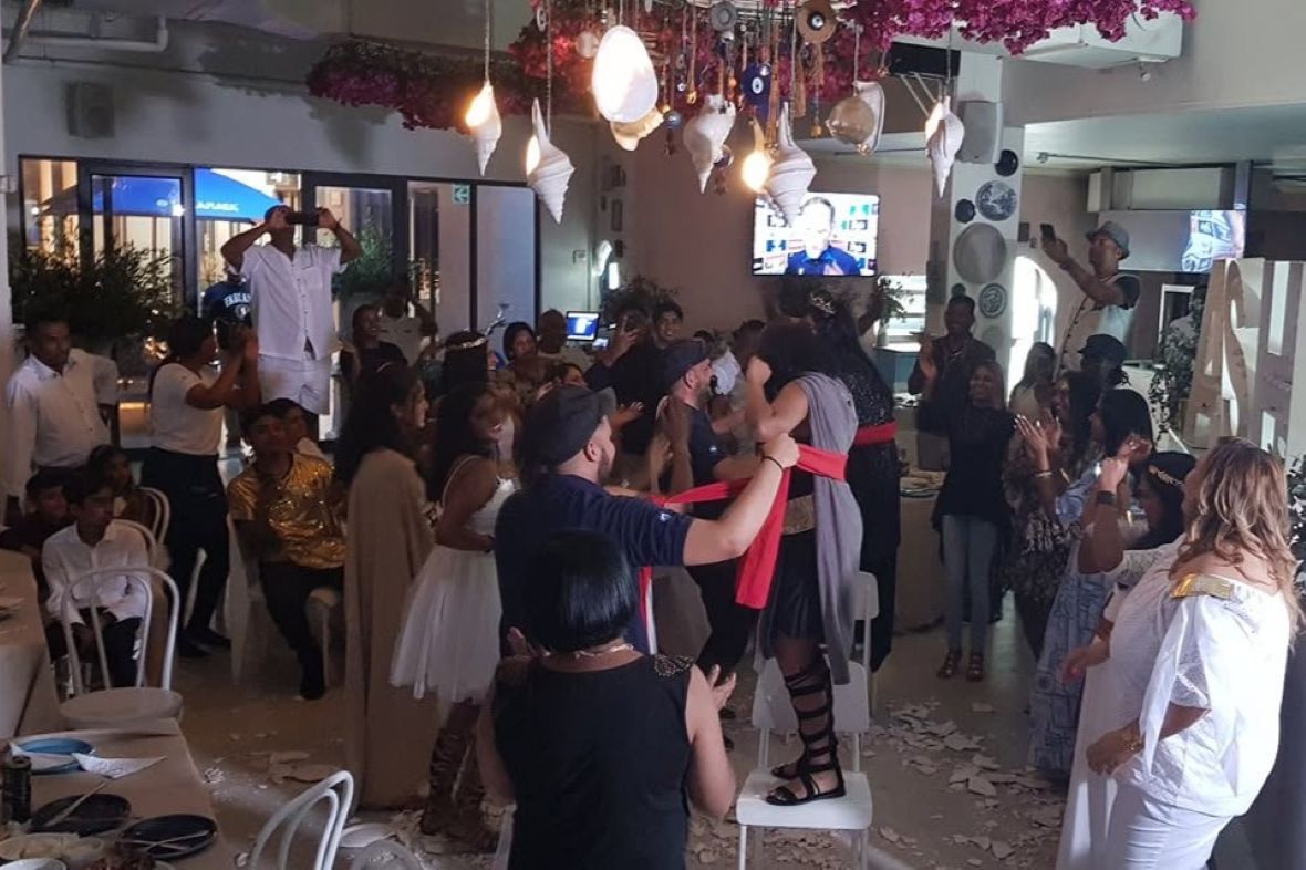 Guests enjoying a costume party game at a Vanish Media hosted celebration